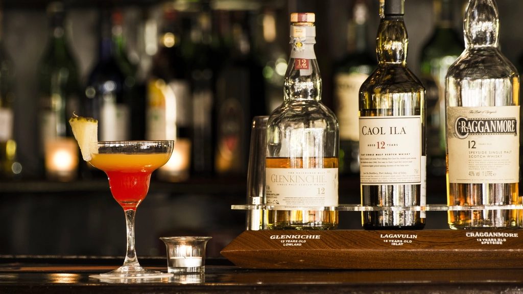 Whisky bottles and a cocktail on the Sable Bar counter