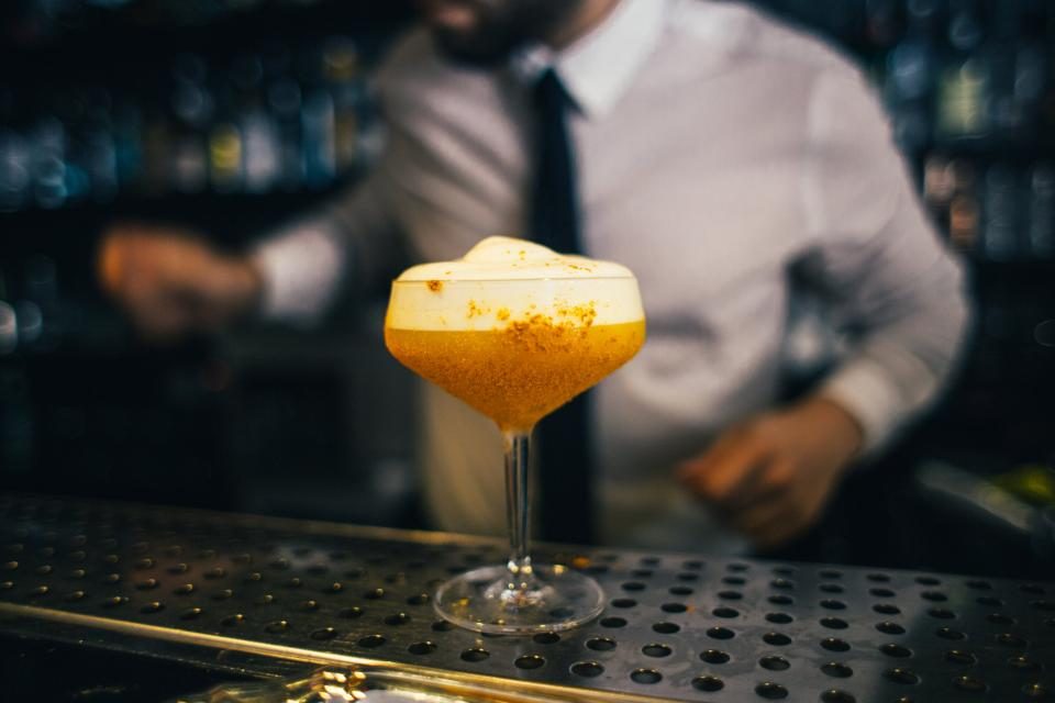 Bartender finishing a cocktail at the Sable Bar