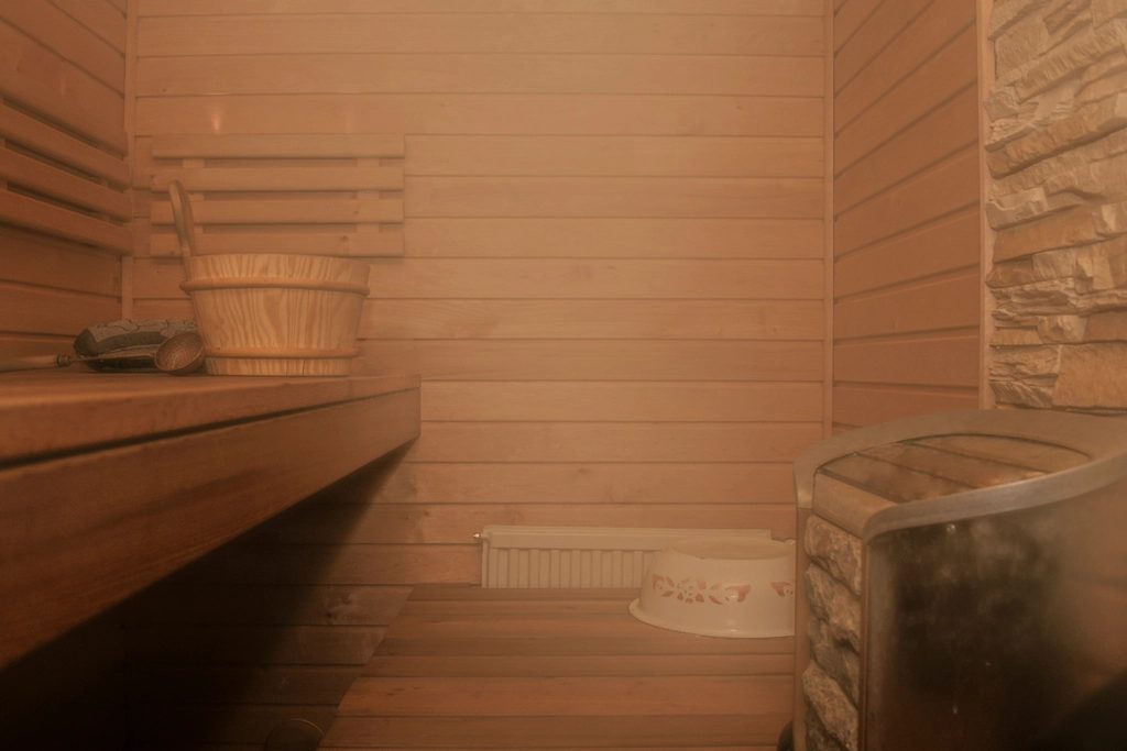 Cedar-lined sauna with warm light